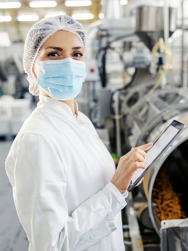 Woman holding tablet on food line Skinny